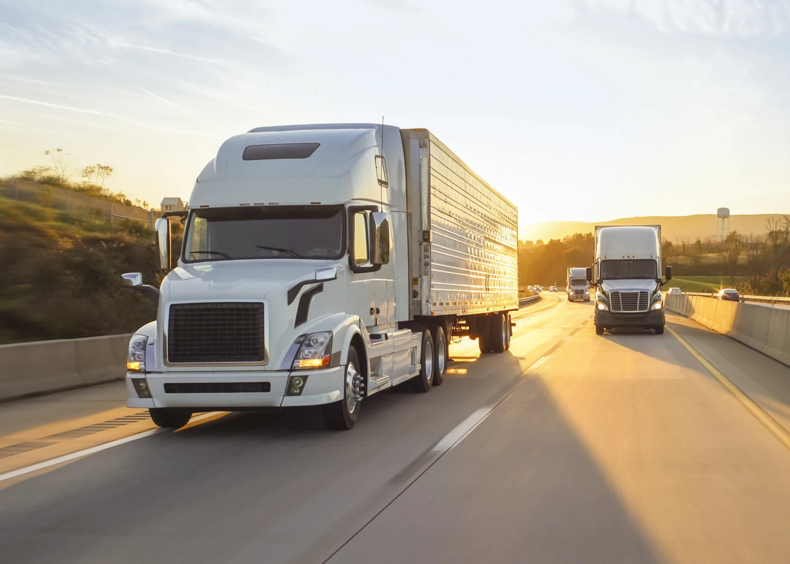 semi-truck-18-wheeler-sunrise-on-highway